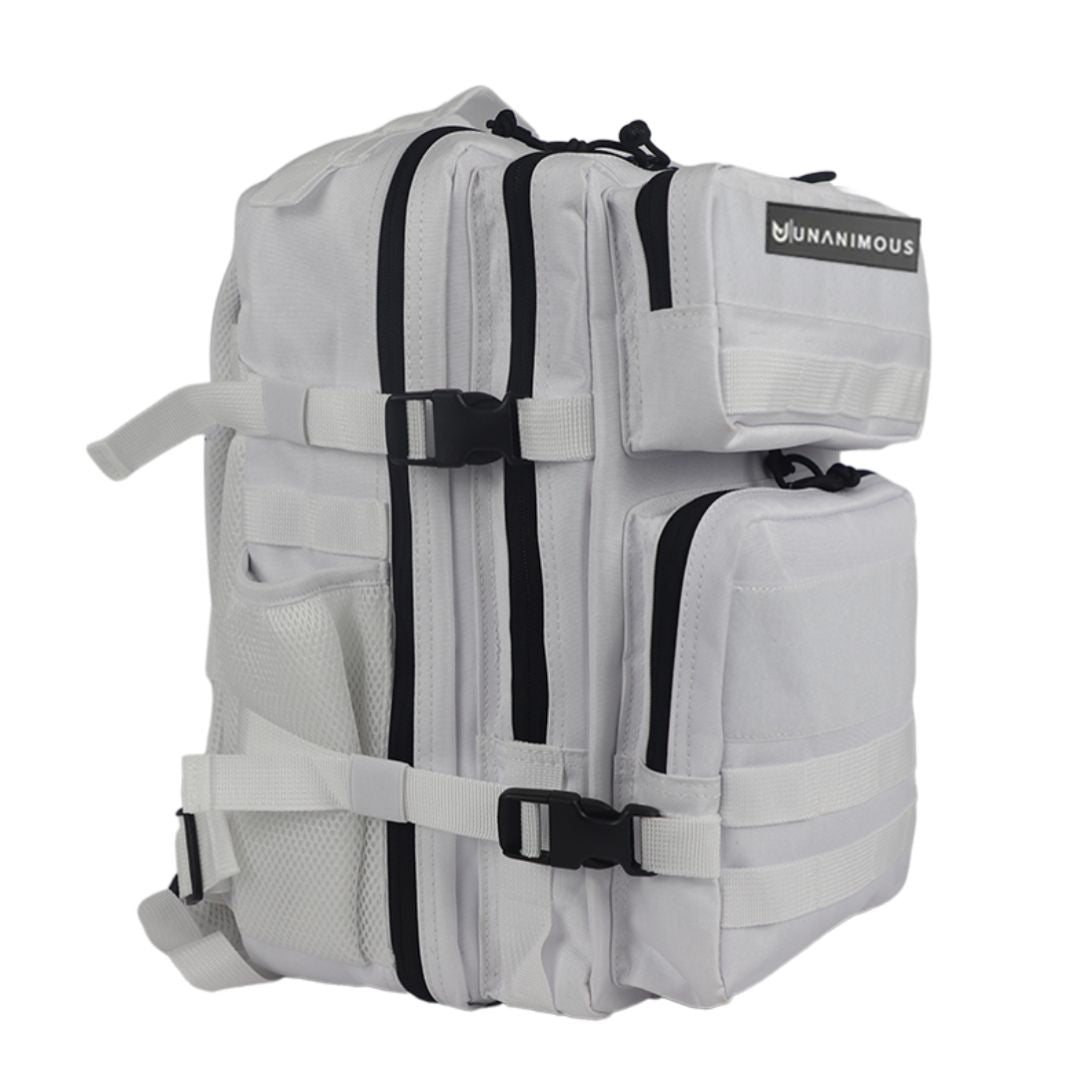 Front view of the white 25L pack focusing on the dual Velcro and front pockets.