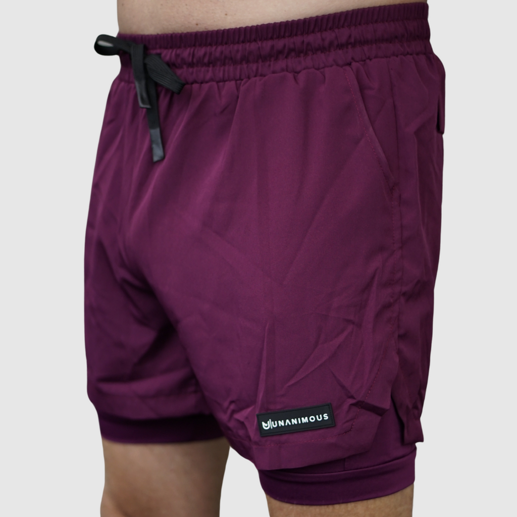 Men’s Training Shorts Elite 2-in-1, multiple pockets, towel loop, comfortable and durable, perfect for workouts and sports.