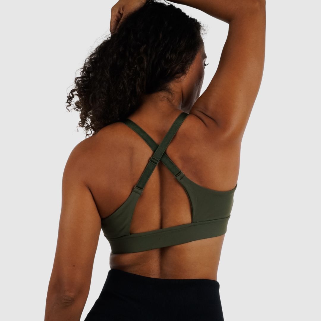 Back view of Olive Green sports bra, showing convertible straps crossed.
