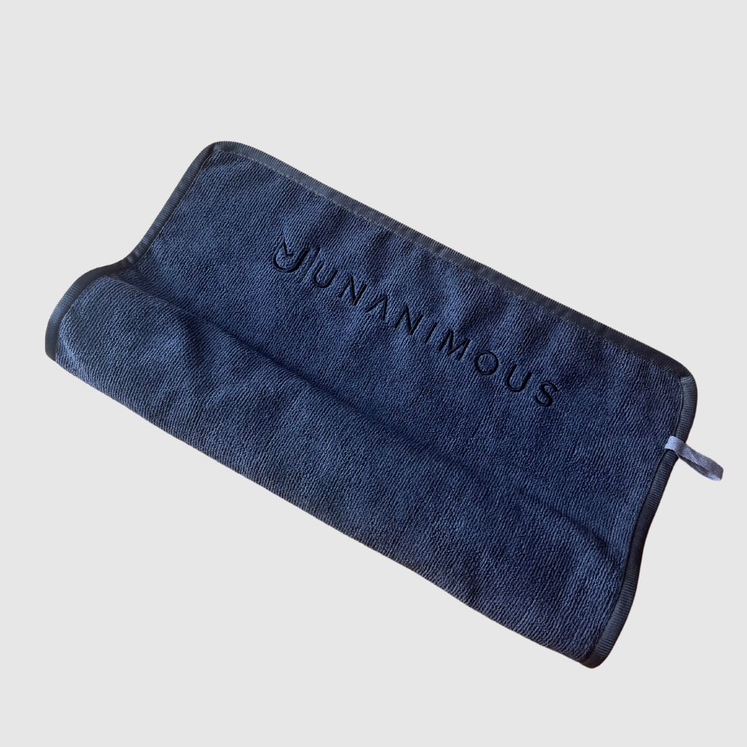 Compact, quick-drying microfiber towel, rolled up for easy gym bag storage.