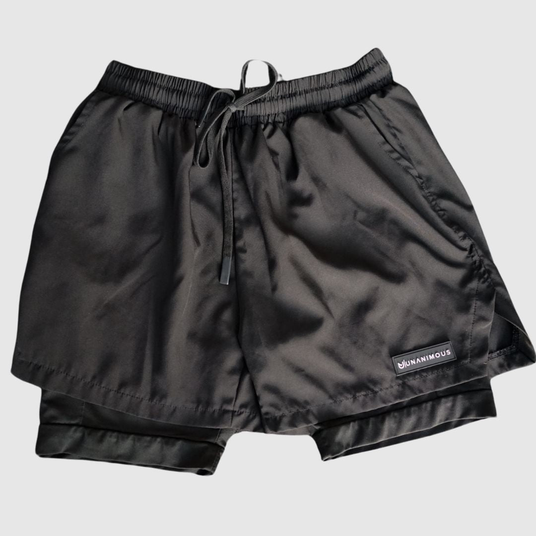 Front view of the black Elite 2-in-1 training shorts, highlighting the double layer.
