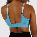 Full body view of model wearing the secure black Cross Sports Bra