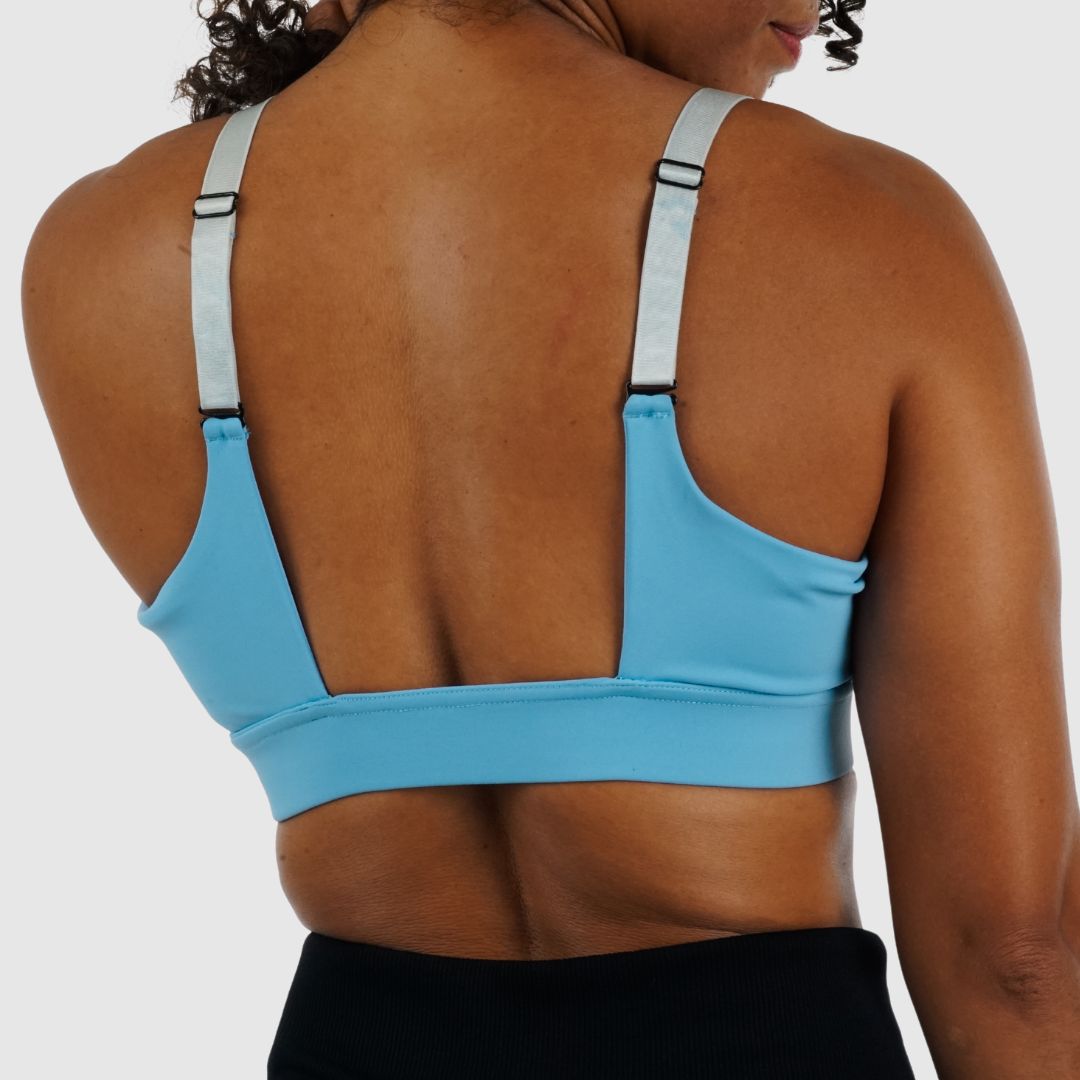 Full body view of model wearing the secure black Cross Sports Bra