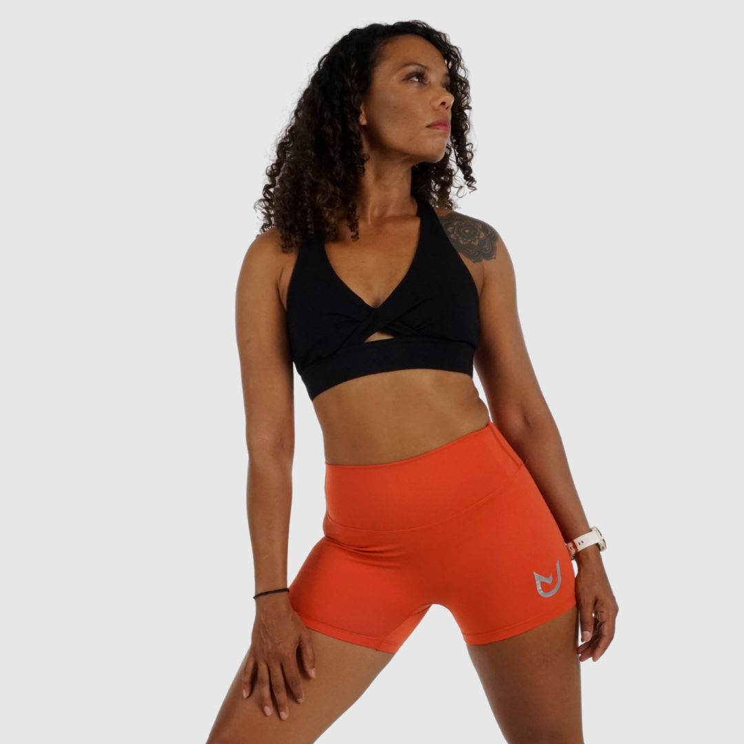 Full view of orange Performance Shorts, squat-proof Nylon-Spandex blend.