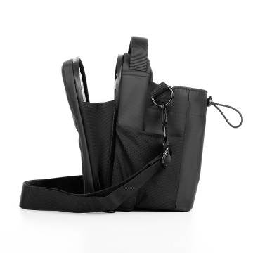 Insulated bottle secured in the exterior side pocket of the Magnetic Bottle Gymbag.