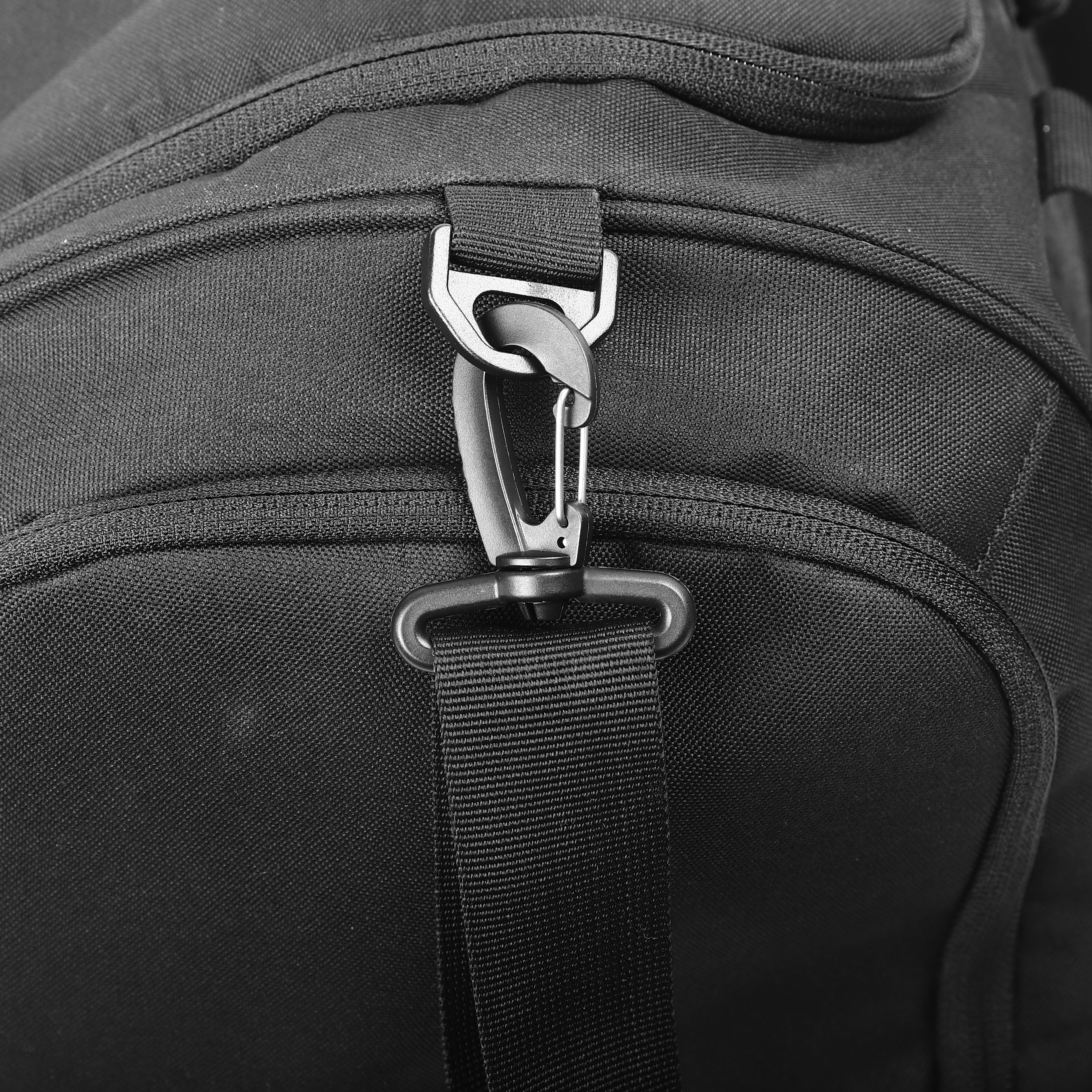 Metal clasp and attachment point detail on the durable black sports bag strap.