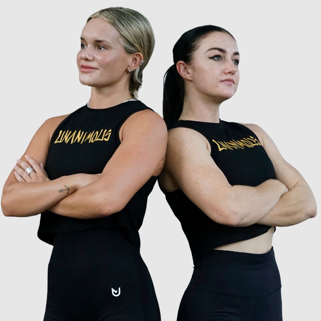 Model wearing the stylish black cotton crop tank for CrossFit workouts.