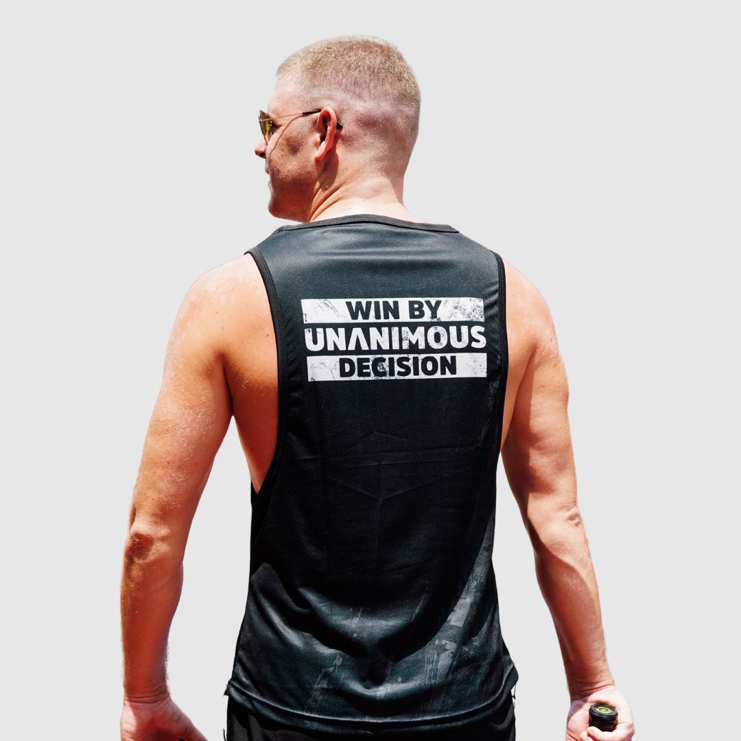 Rear view of the black tanktop, showing "WIN BY UNANIMOUS DECISION" back print.