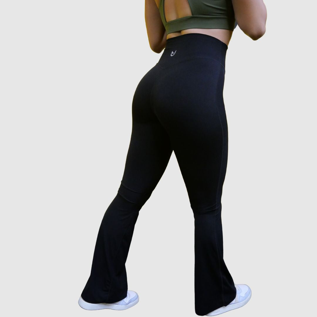 Side profile of Flared Leggings Black highlighting stretch fabric and flared silhouette