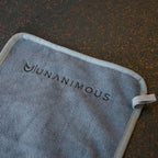 Soft, absorbent 300 GSM microfiber gym towel on workout equipment.