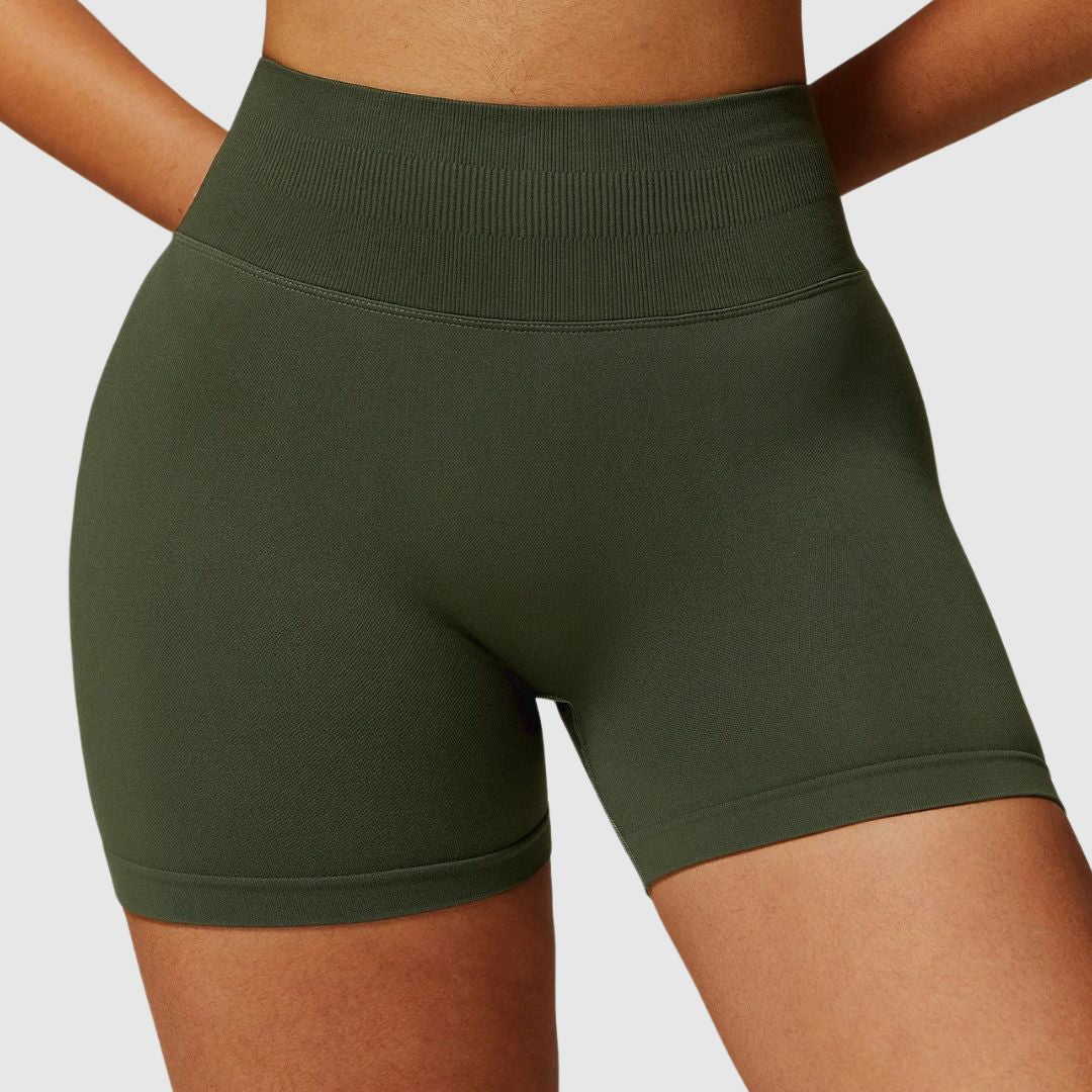 Front view of Vibe Scrunch Shorts dark green showing stretchable waistband and scrunch detail