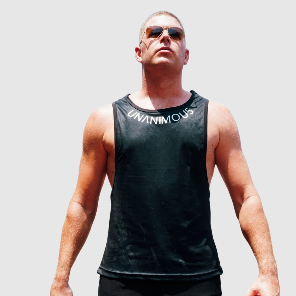wearing the black tanktop, emphasizing fit and athletic build.